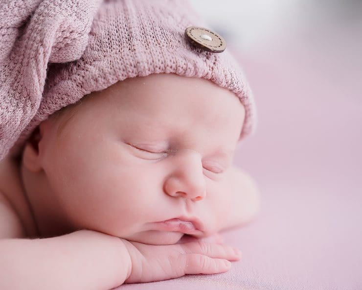 newborn baby ada rose on pink blanket