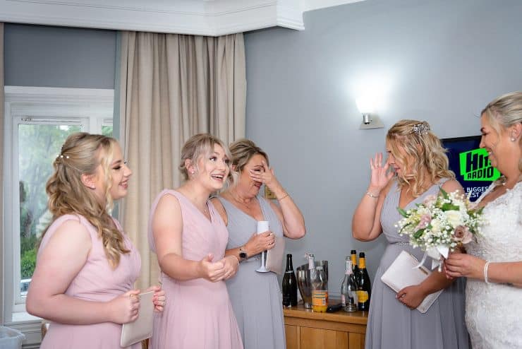 emotional bridesmaid at brides first look