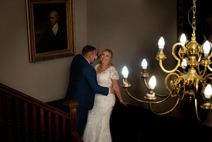 stunning bride and groom portrait on the stairs at the quorn country house in leicester