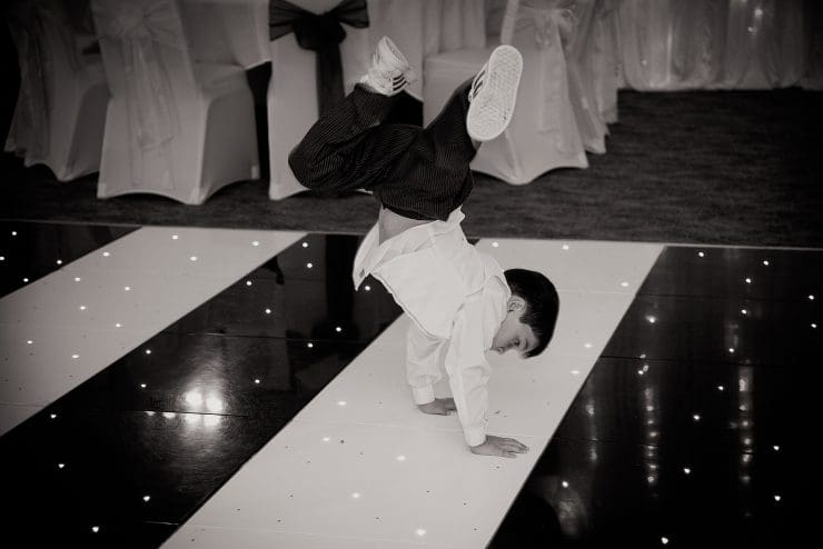 pageboy dancing on the dance floor at mum and dads wedding