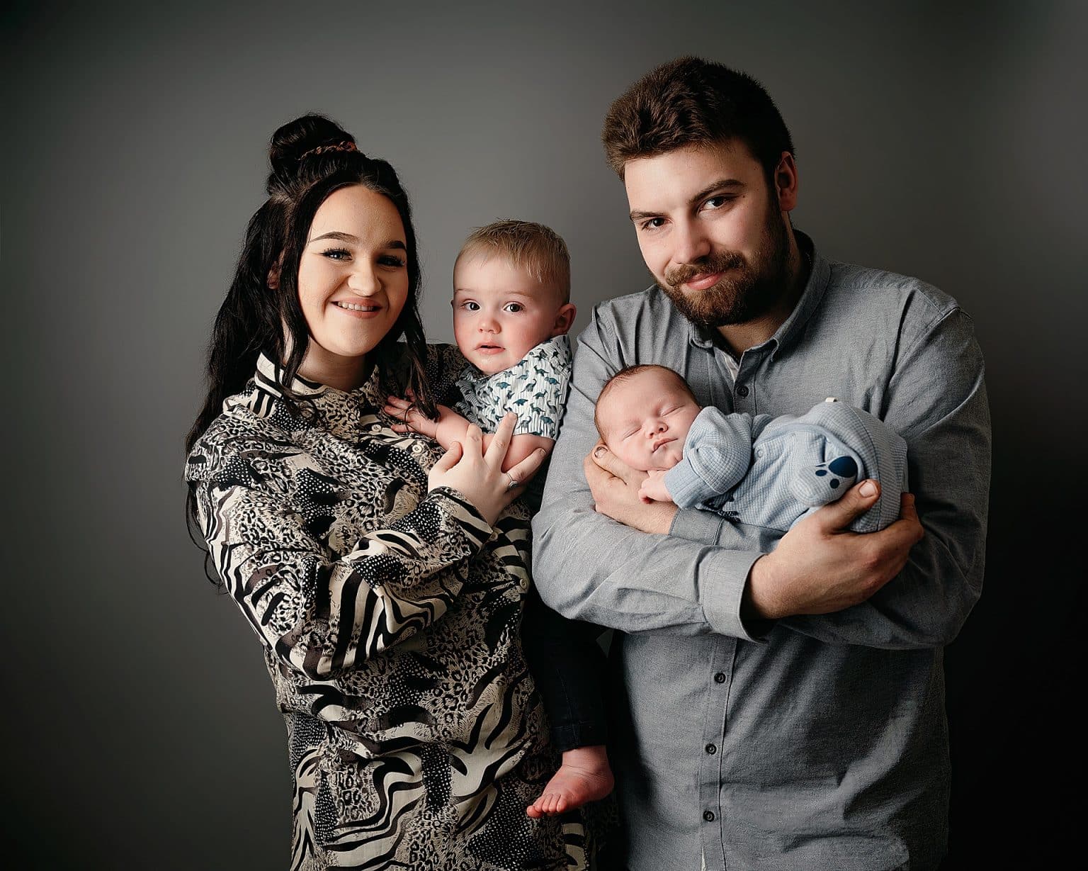 mum and dad with Newborn baby posing