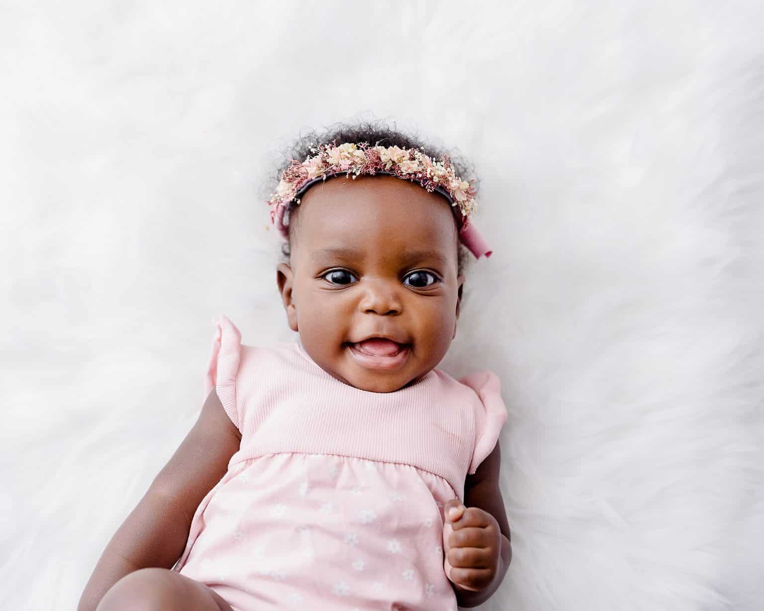little girl sat in a bed