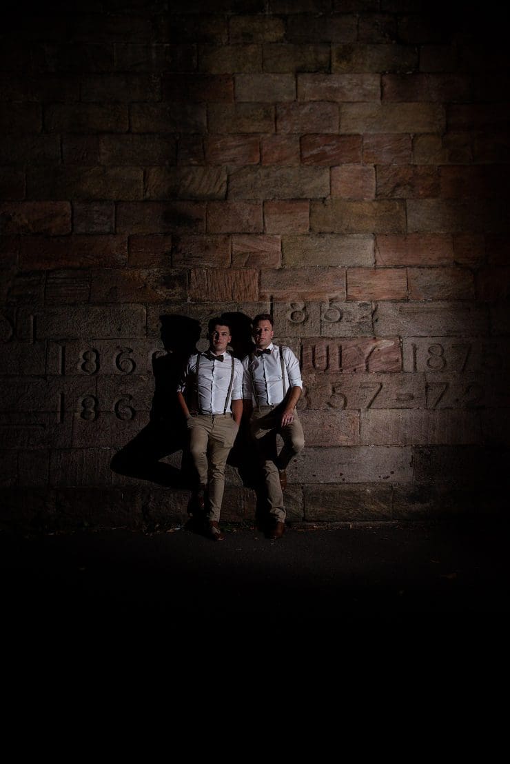 night photo of the groom and groom along the river side of the trent in nottingham on their wedding day