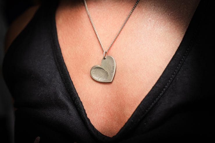special memory necklace, its a heart with a thumb print of her nan