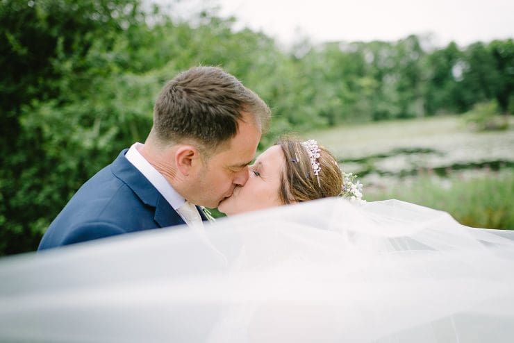 veil shoot kissing bride and groom at Colwick hall nottingham