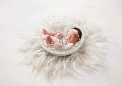 newborn baby girl on a digital background