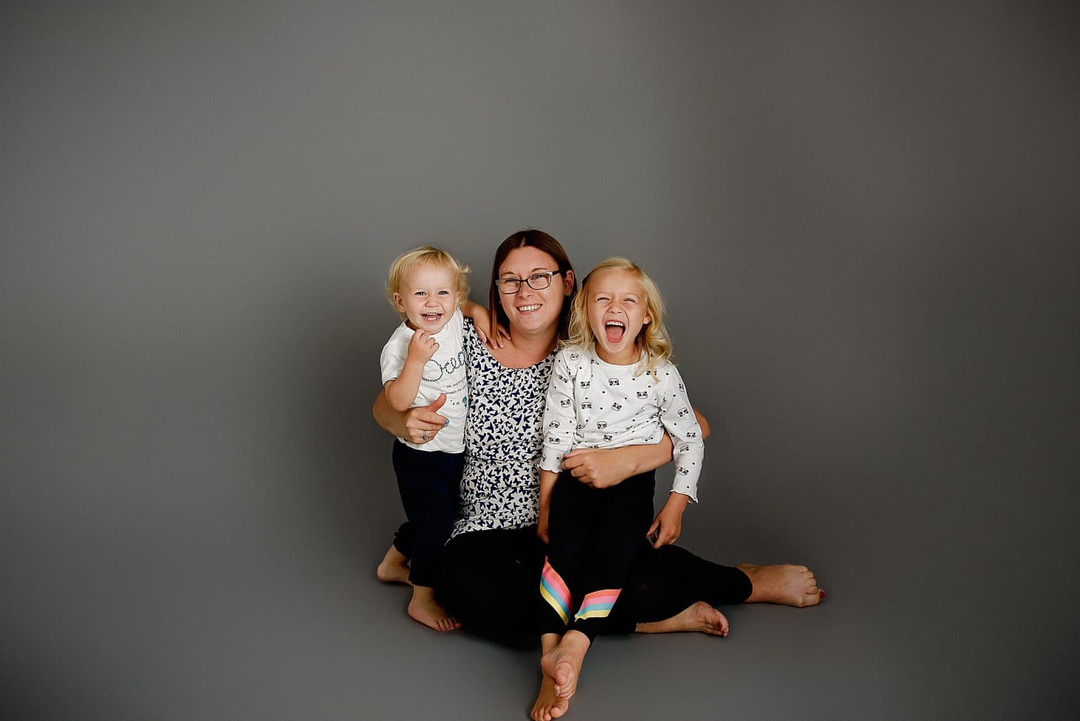 mummy and me photo shoot where mum is together with her two children