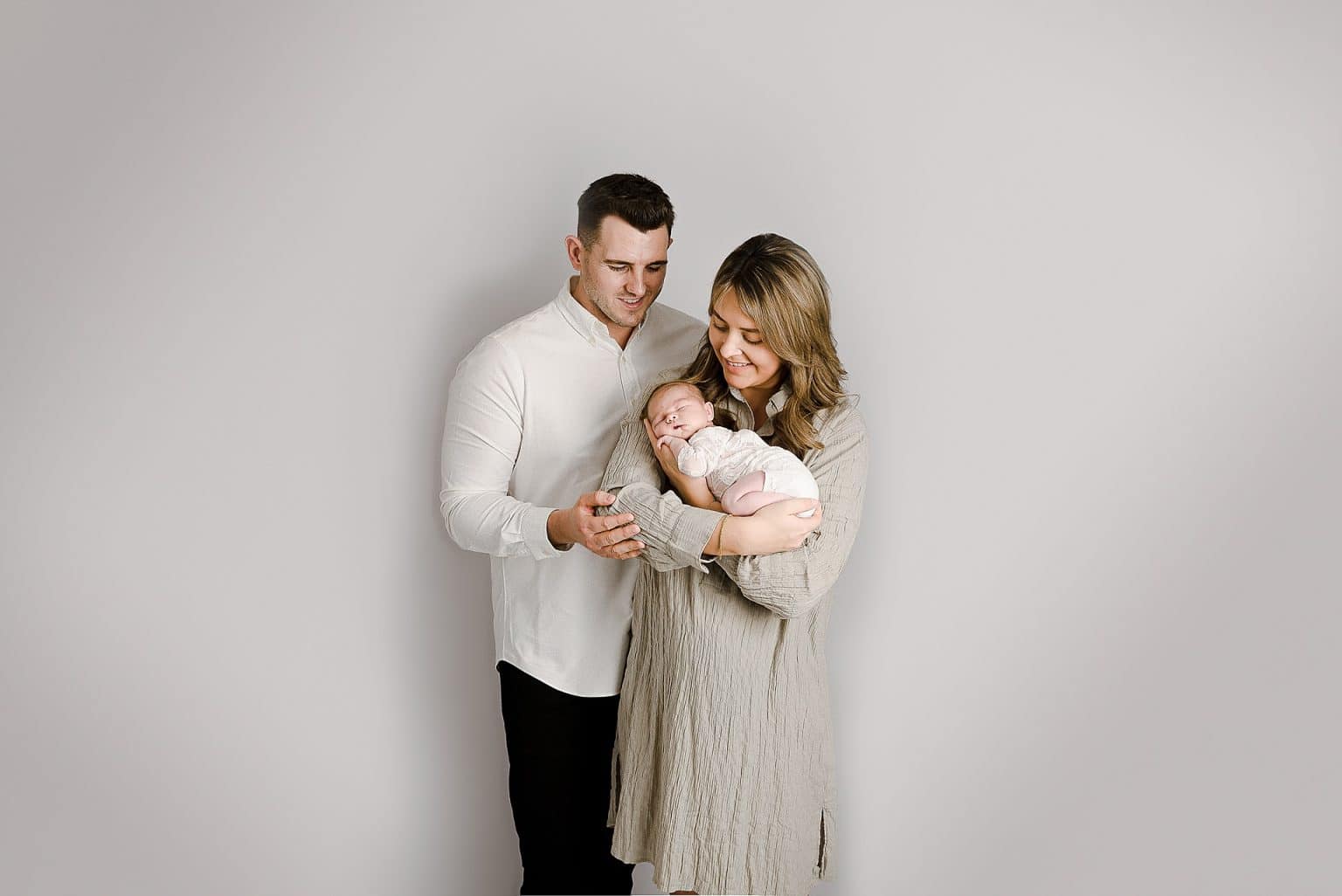 newborn baby parent posing