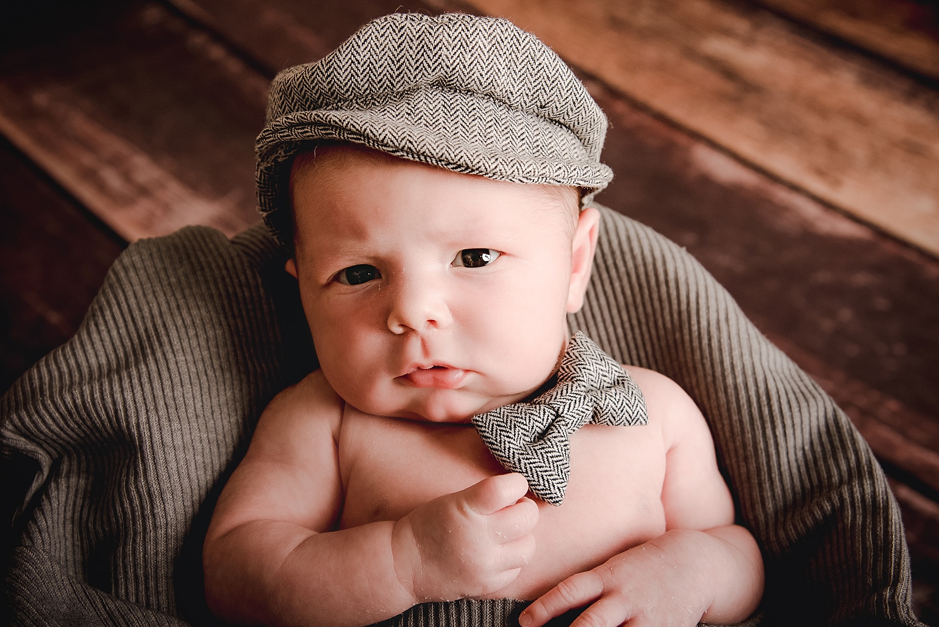 newborn baby looking right at the camera