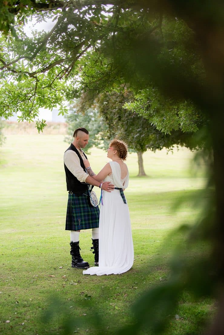 bride and groom in the grounds at eastwood hall in nottingham