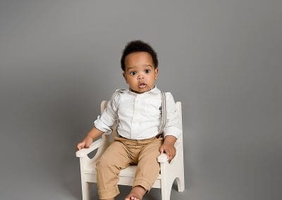 little boy sat on a chair