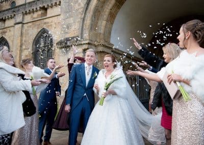 confetti at the bride and groom outside southwell westminster church