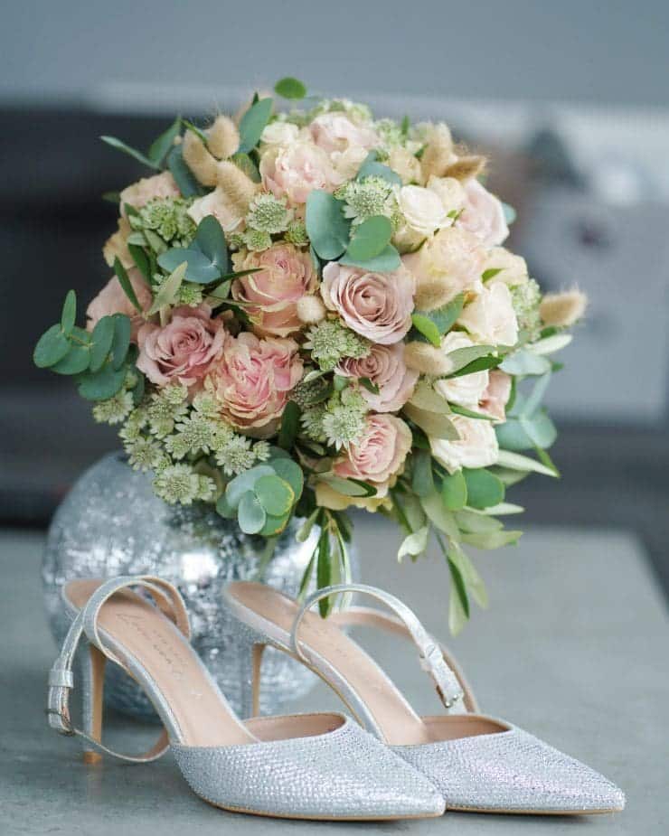Wedding shoes with brides flowers Rachael Phillips Photography - Nottingham and Derby Wedding Photographer.