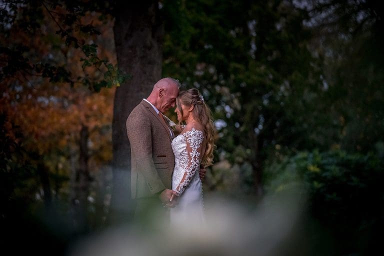 bride and groom just as the sun is going down on her wedding day by nottingham wedding photographer and derby wedding photographer