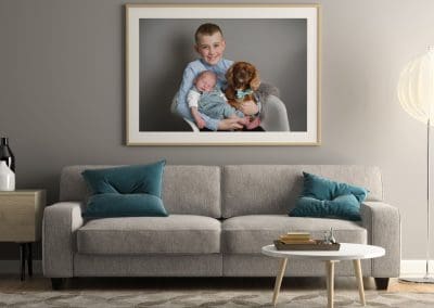 wall art sample of a family on a grey wall above the sofa