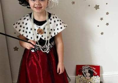 LITTLE GIRL DRESSED UP FOR WORLD BOOK DAY AS 101 DALMATIONS