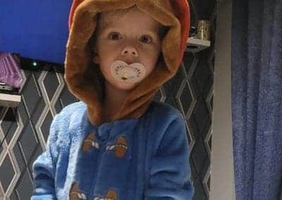 little boy dresses up as paddington bear