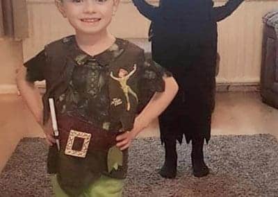 Boy dresses up as peter pan and his sister dresses as his shadow