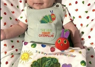 cute little baby dressed as the hungry caterpillar for world book day
