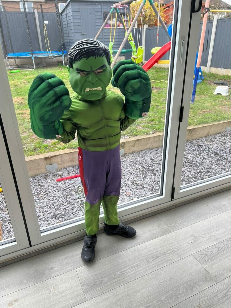 young boy dressed as the hulk for world book day