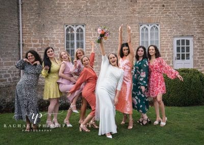 the bride with her best friends all being silly at Cockliffe country house in Nottingham