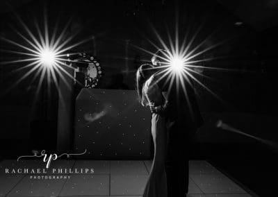 first dance photo of the bride and groom with two big starburst lights behind them at the cockliffe country house in Nottingham