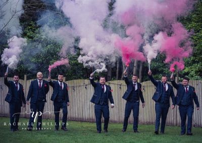 Smoke bomb photo with the groom and his groomsmen at Thoresby Hall in Newark, Nottingham