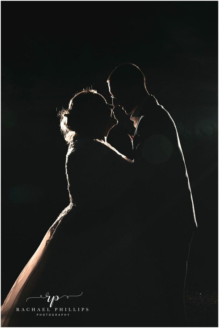 silhouette photo of the bride and groom