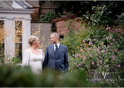 bride and groom in the flower gardens at Langar Hall in Nottingham