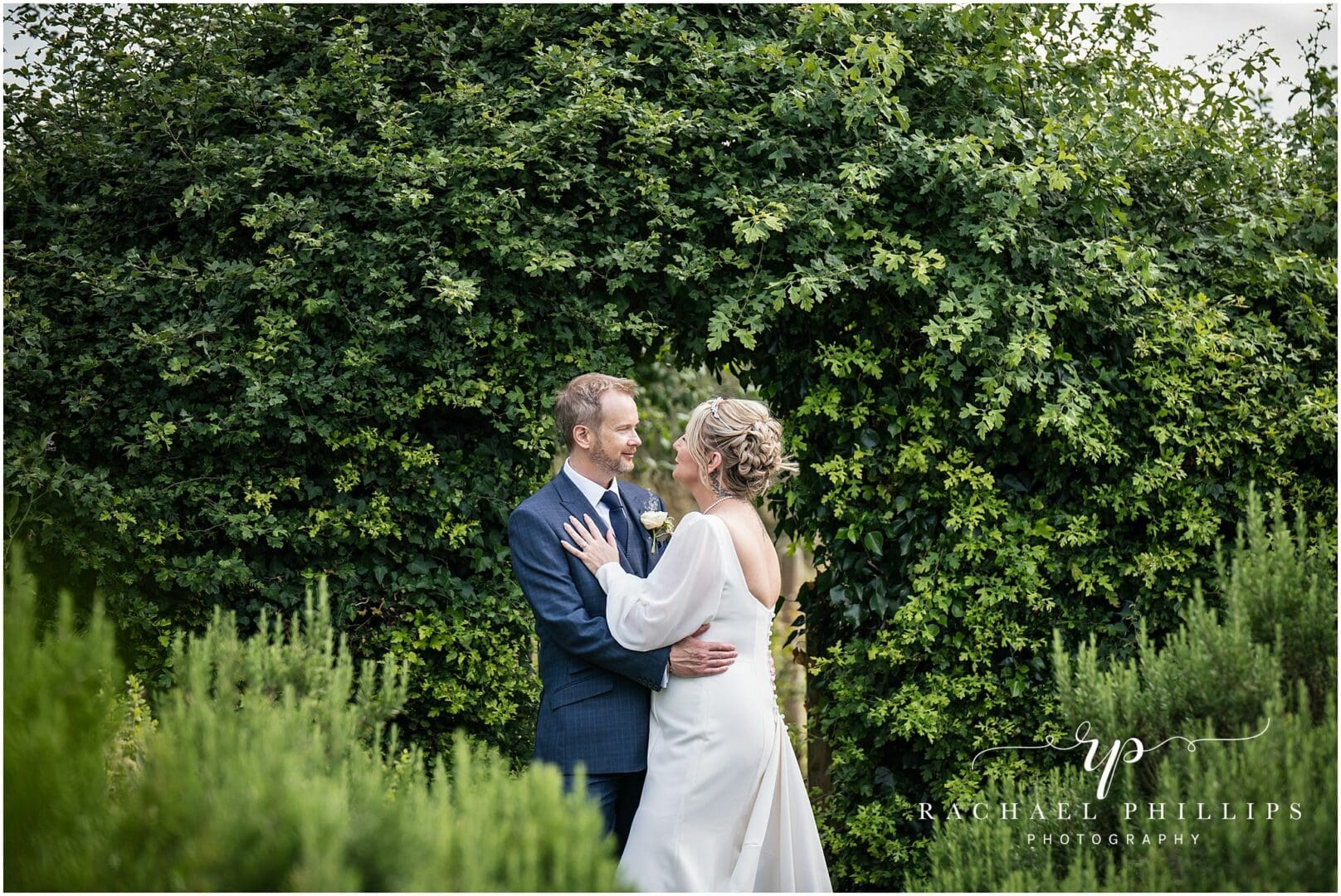 the bride and groom in the gardens of langar hall in Nottingham