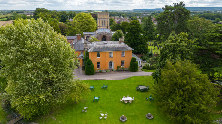 English countryside estate with church and green lawns.
