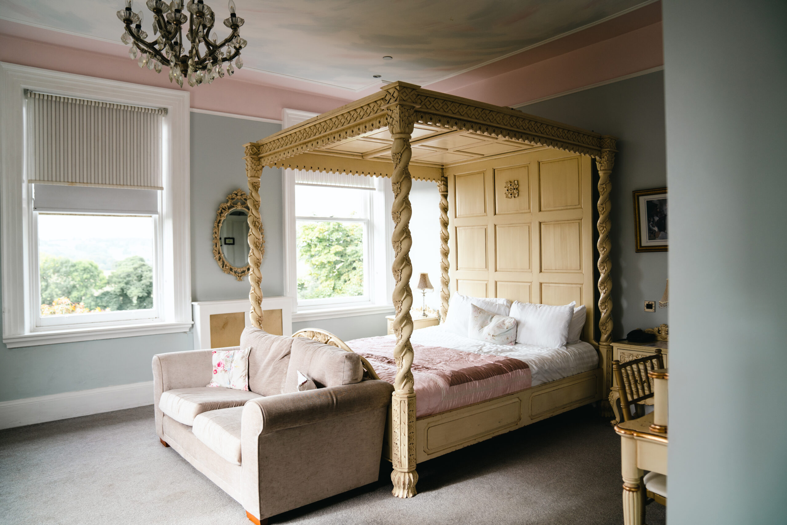 Elegant bedroom with a four-poster bed.
