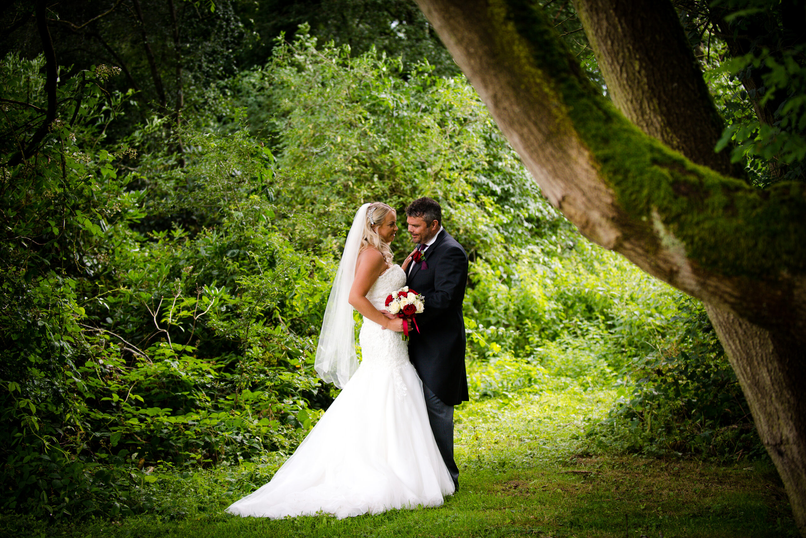 Bride and groom in a forest setting
