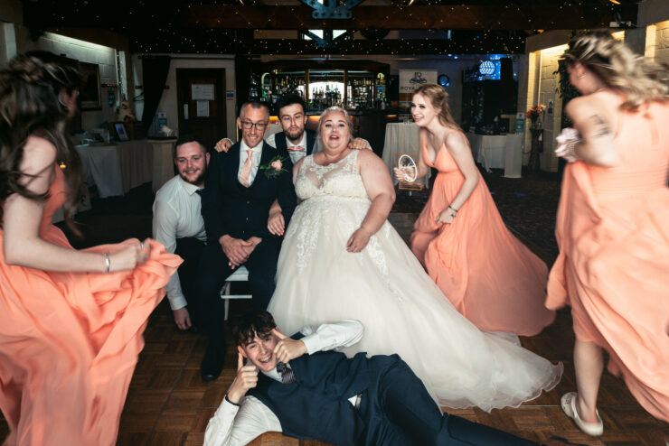 Cheerful wedding party with bride and bridesmaids.