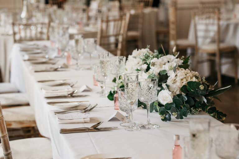Elegant table setting with floral arrangement.