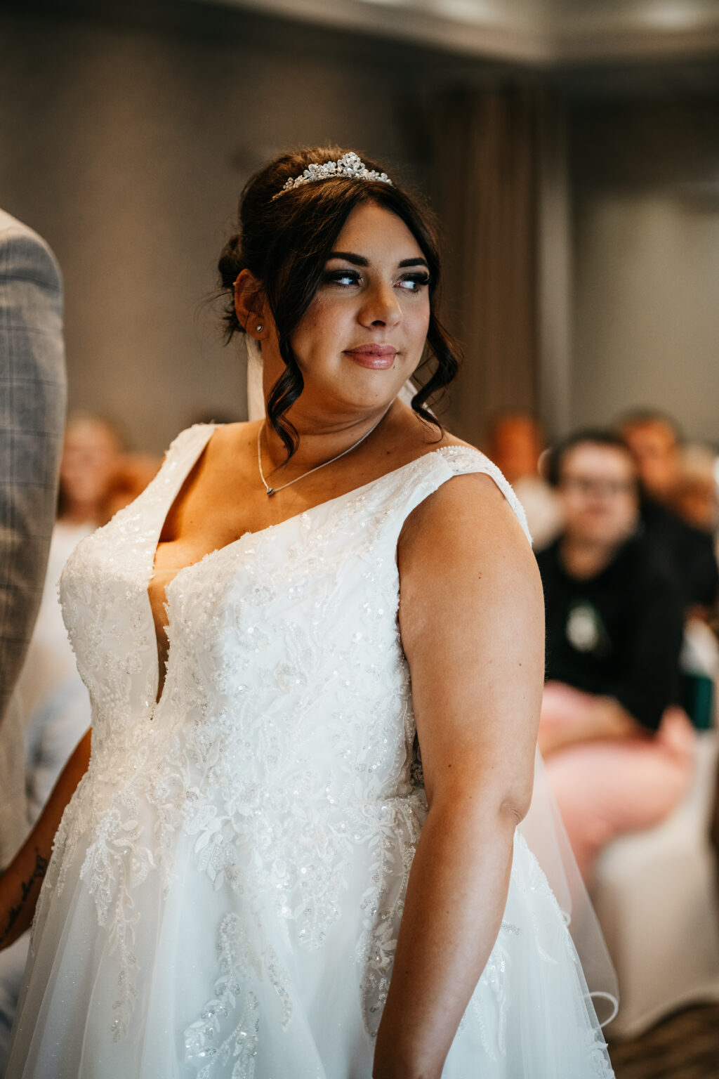 Bride smiling in elegant wedding dress