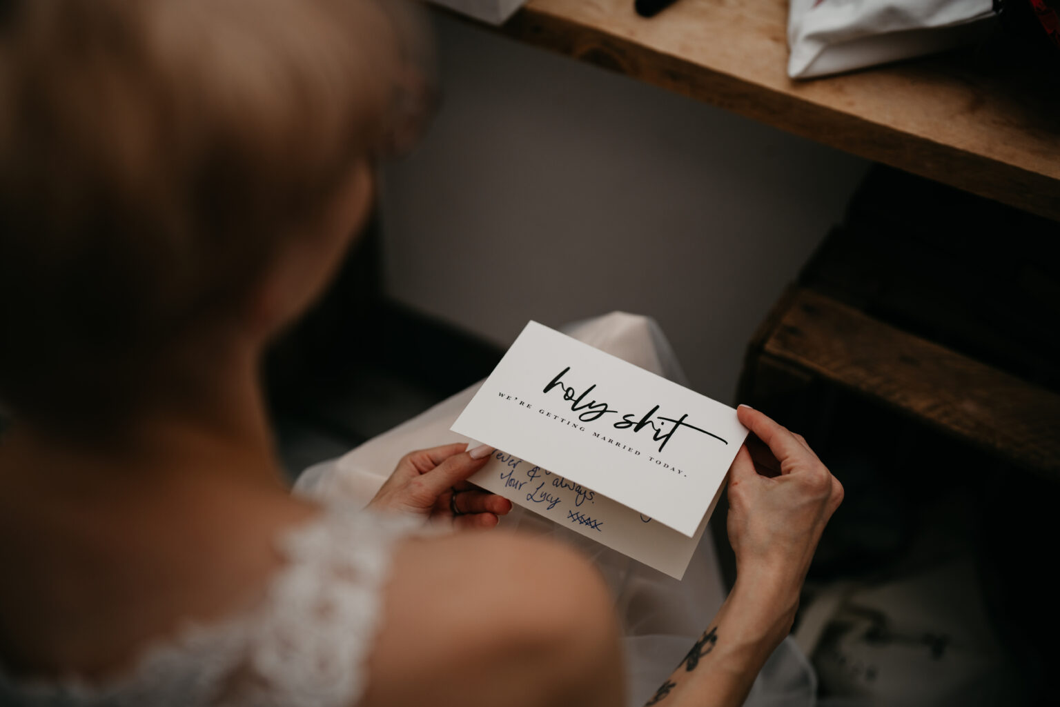 Person holding humorous wedding card message