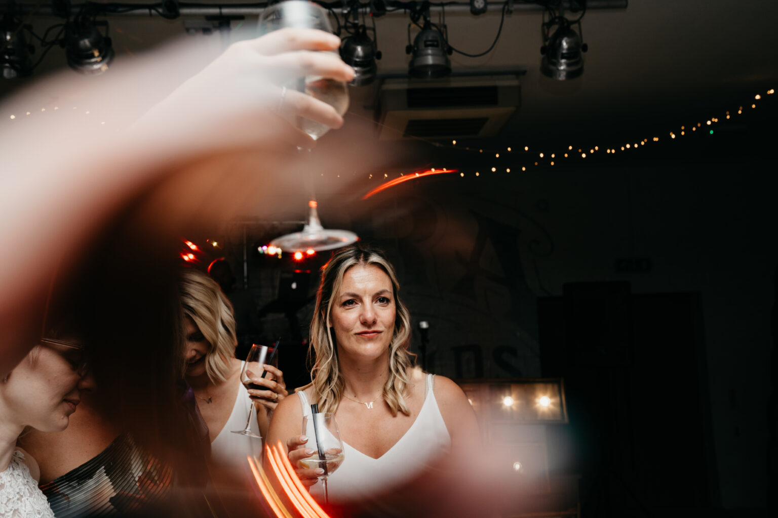 People celebrating with drinks at a party.