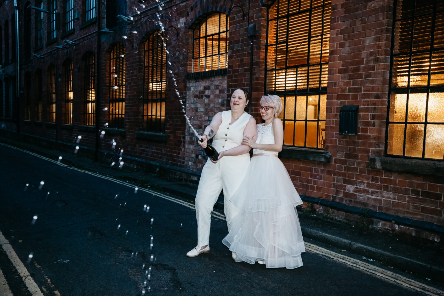 Couple celebrating with champagne on wedding day