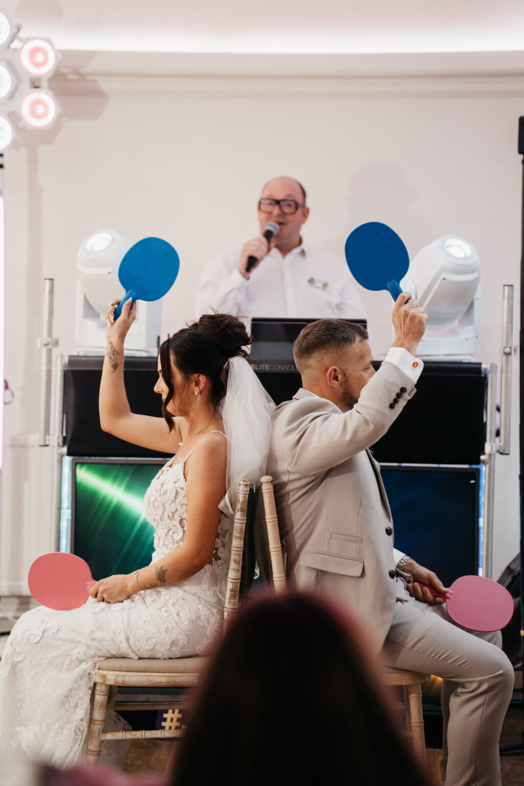 Bride and groom playing wedding shoe game